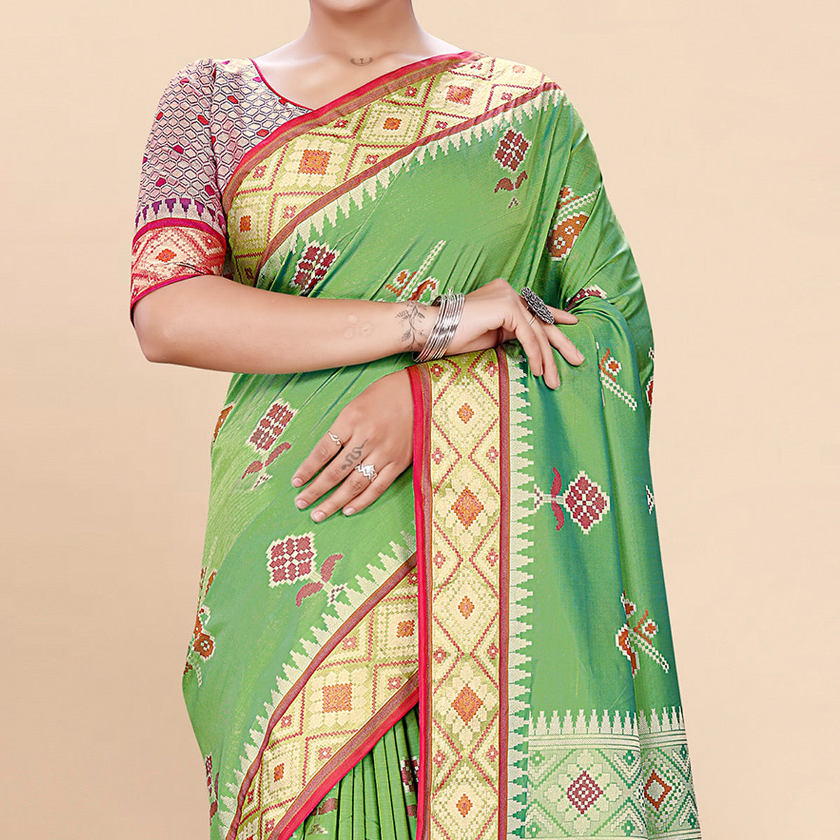 green-woven-patola-art-silk-saree-with-tassels-1
