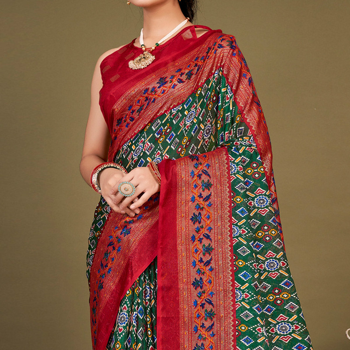 green-printed-jute-patola-saree-with-tassels