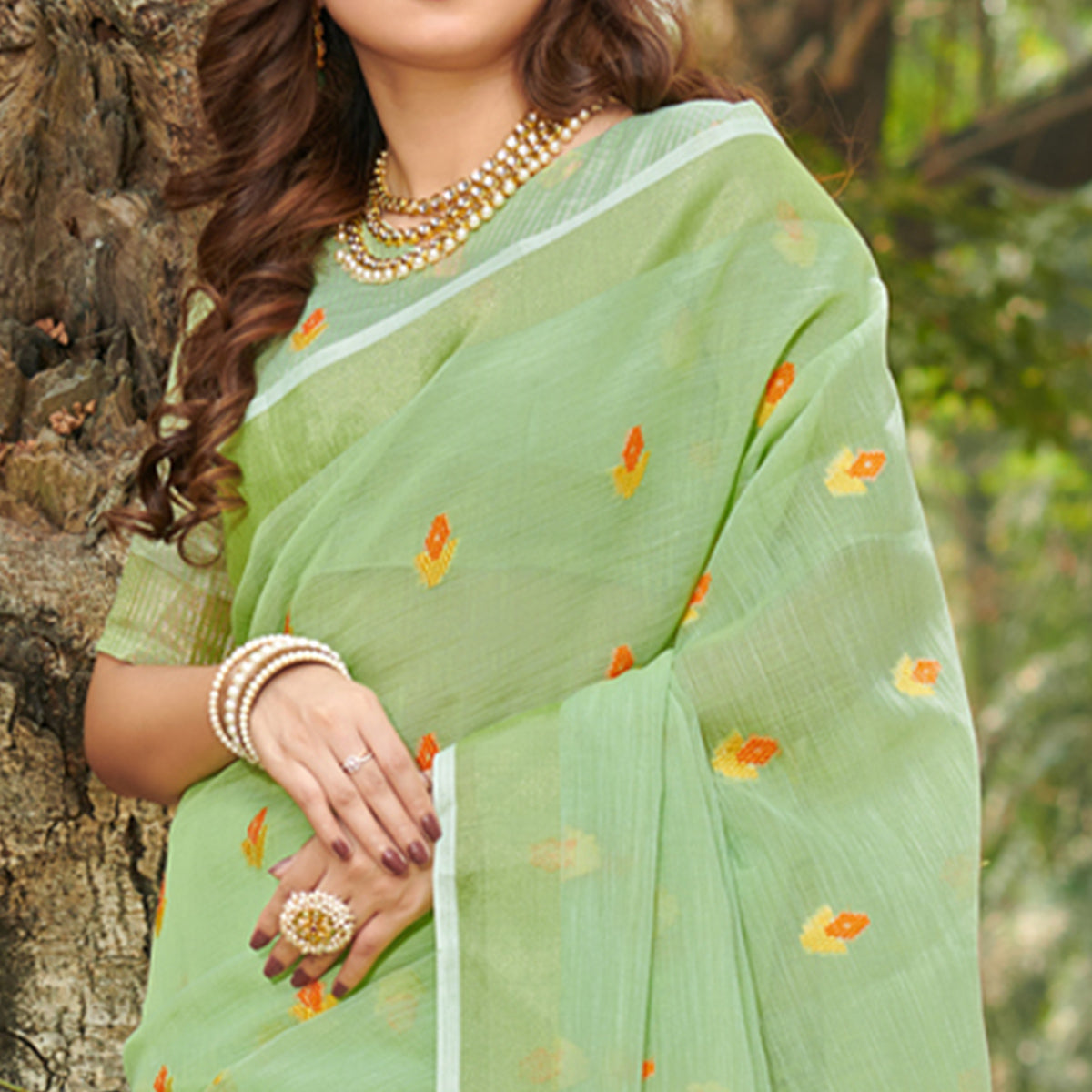 green-embroidered-linen-saree-with-tassels