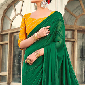 green-printed-georgette-saree-with-tassels-1