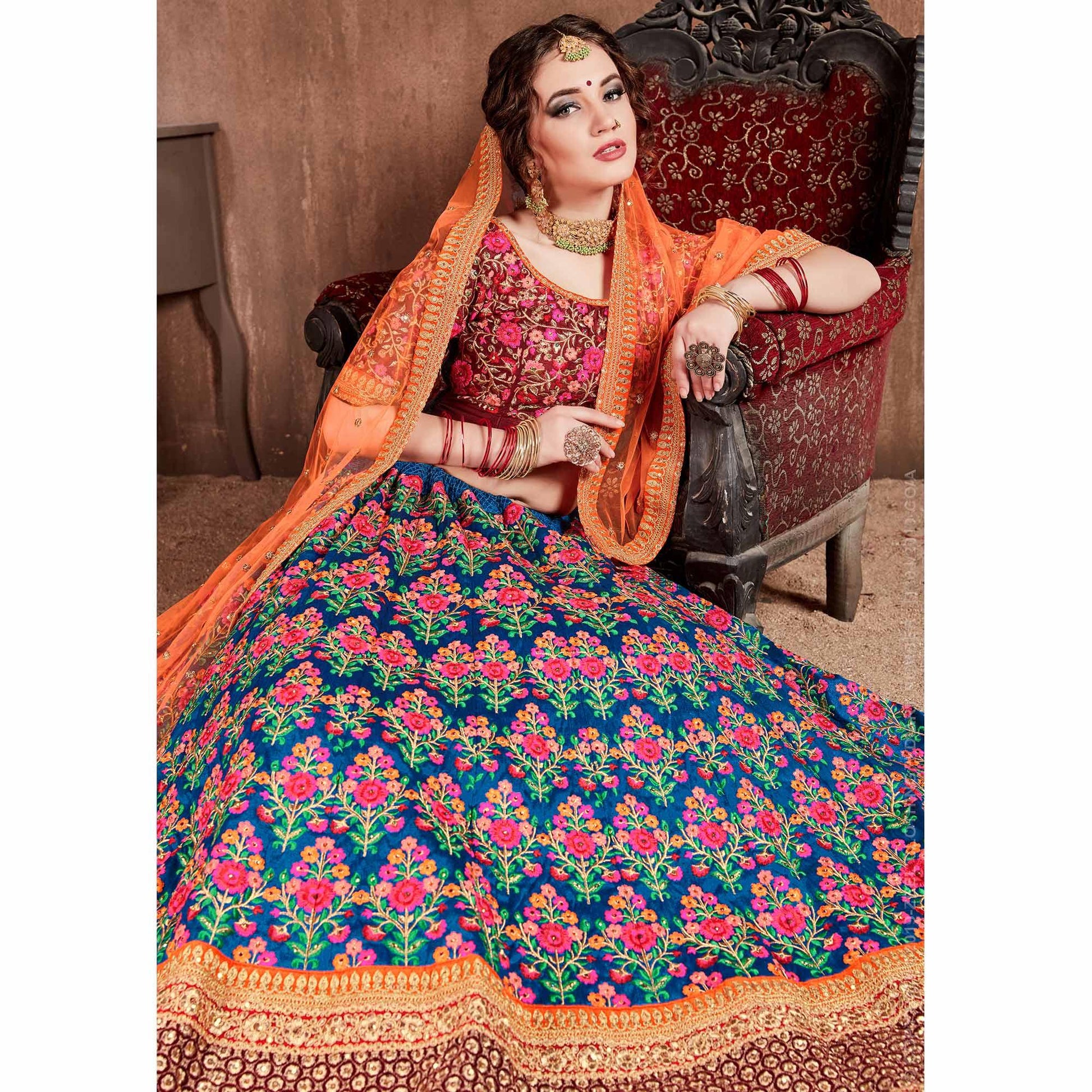 Flamboyant Blue-Red Colored Partywear Embroidered Mulberry Silk Lehenga Choli