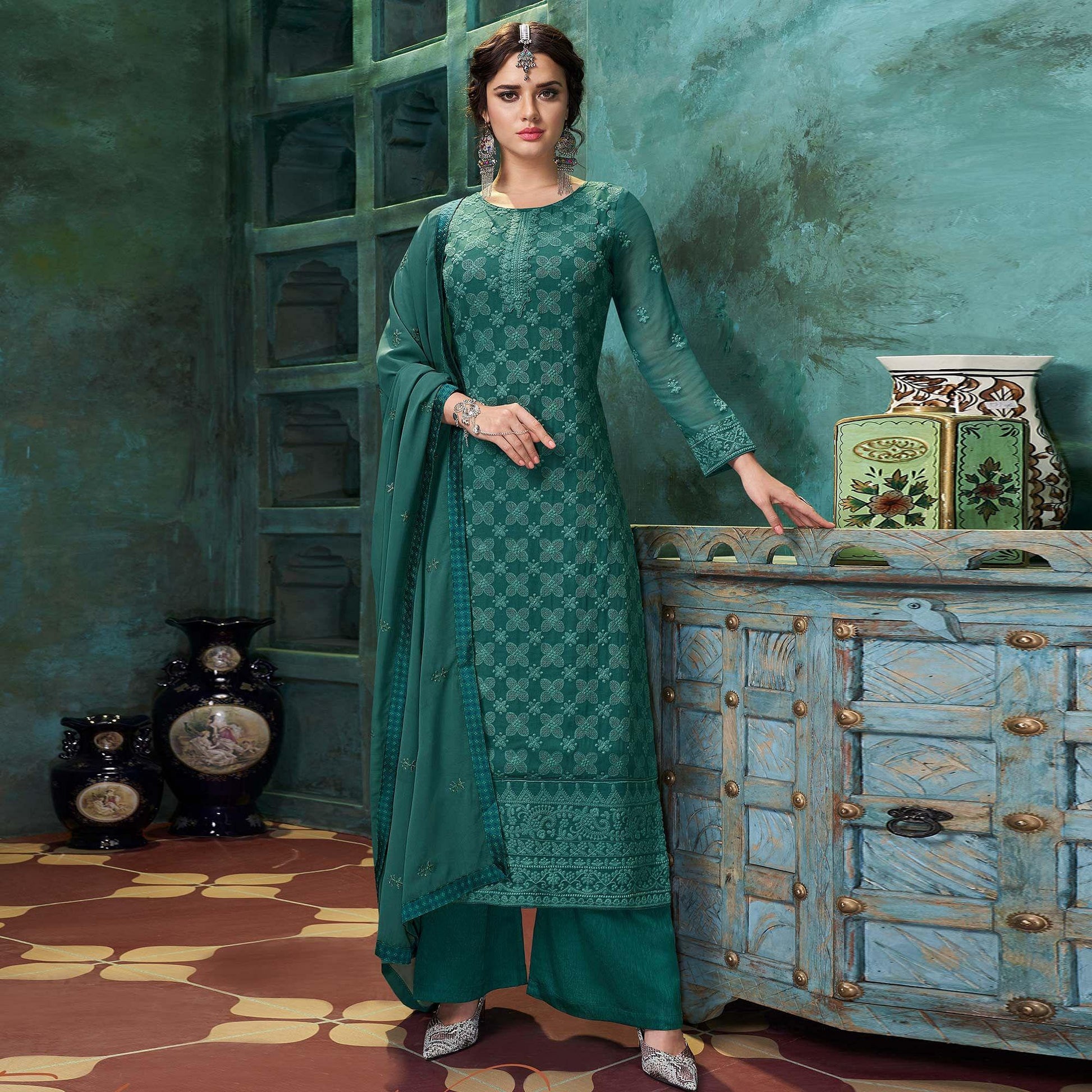 Flamboyant Dark Green Colored Partywear Embroidered Heavy Faux Georgette Palazzo Suit