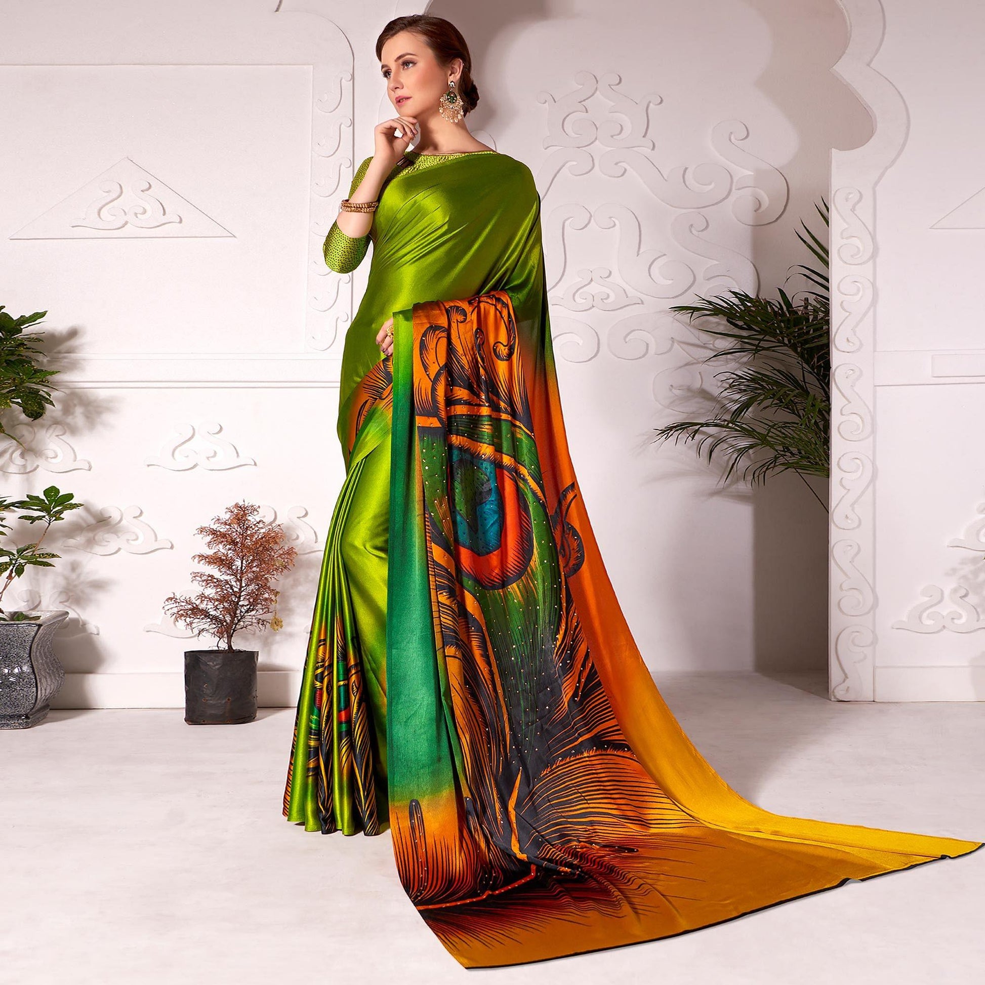 Flamboyant Olive Green Colored Partywear Peacock Feather Printed Satin Saree