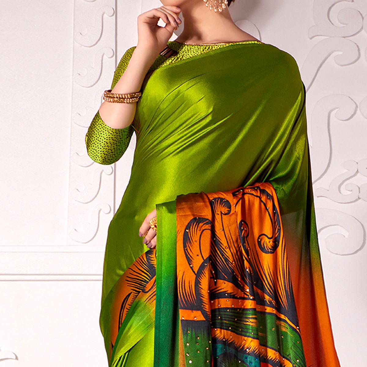Flamboyant Olive Green Colored Partywear Peacock Feather Printed Satin Saree