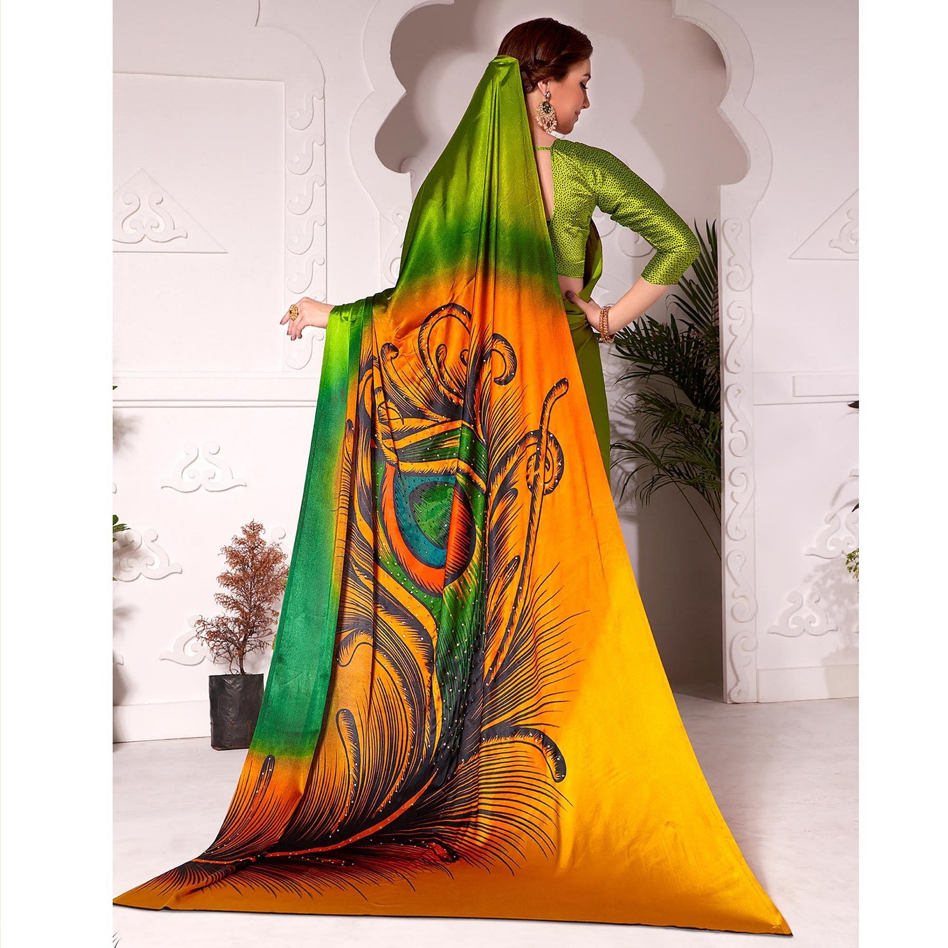 Flamboyant Olive Green Colored Partywear Peacock Feather Printed Satin Saree