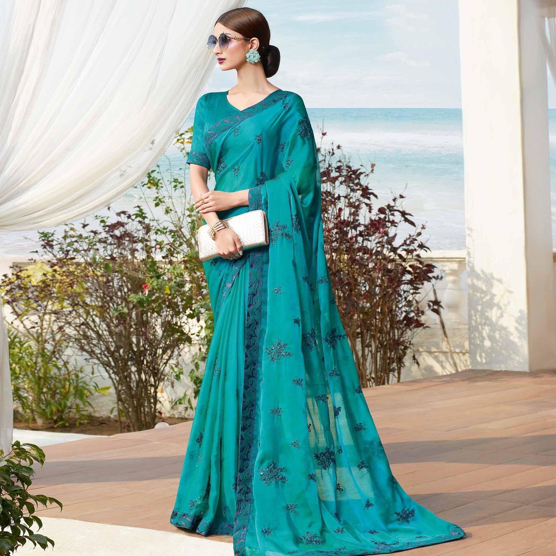 Flamboyant Rama Blue Colored Partywear Embroidered Georgette Saree