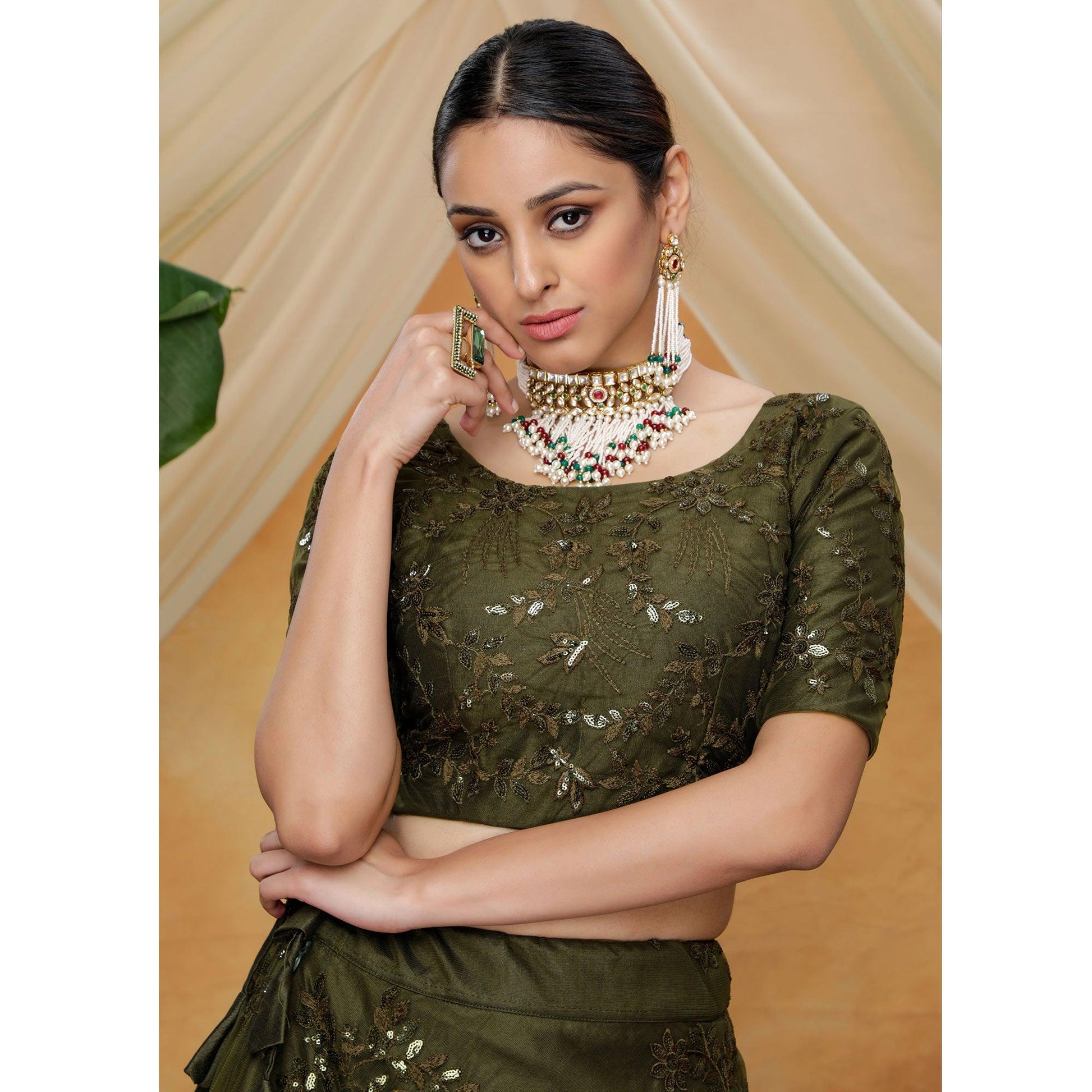 Flattering Olive Green Colored Designer Partywear Embroidered Net Lehenga Choli