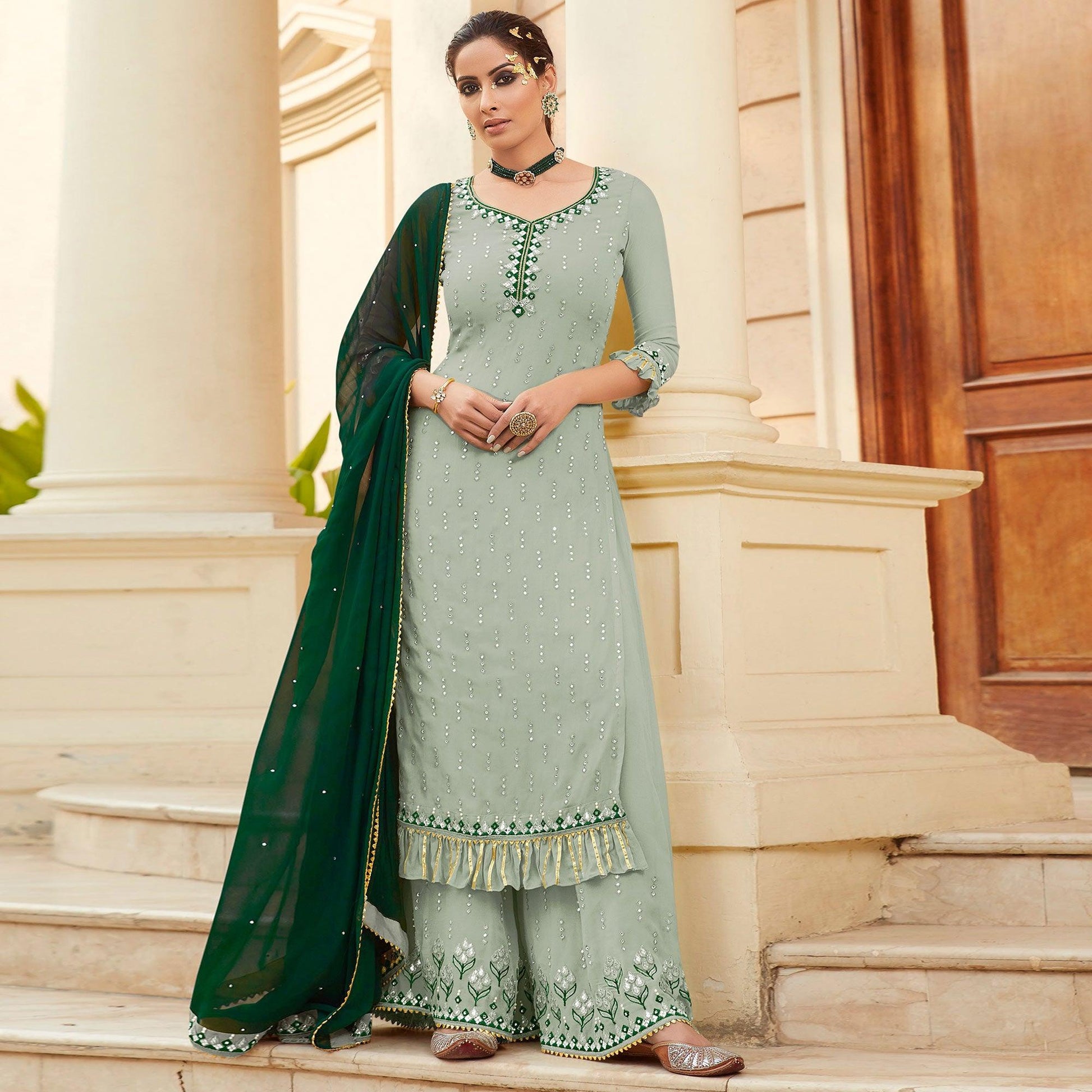 Flattering Pastel Green Colored Partywear Embroidered Georgette Palazzo Suit