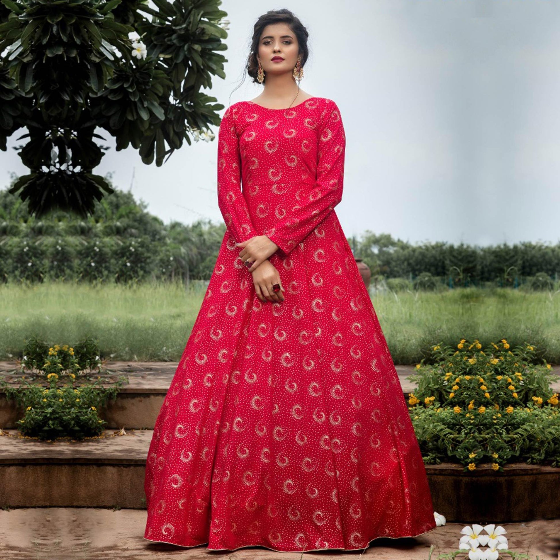 Flattering Pink Colored Party Wear Foil Printed Georgette Gown