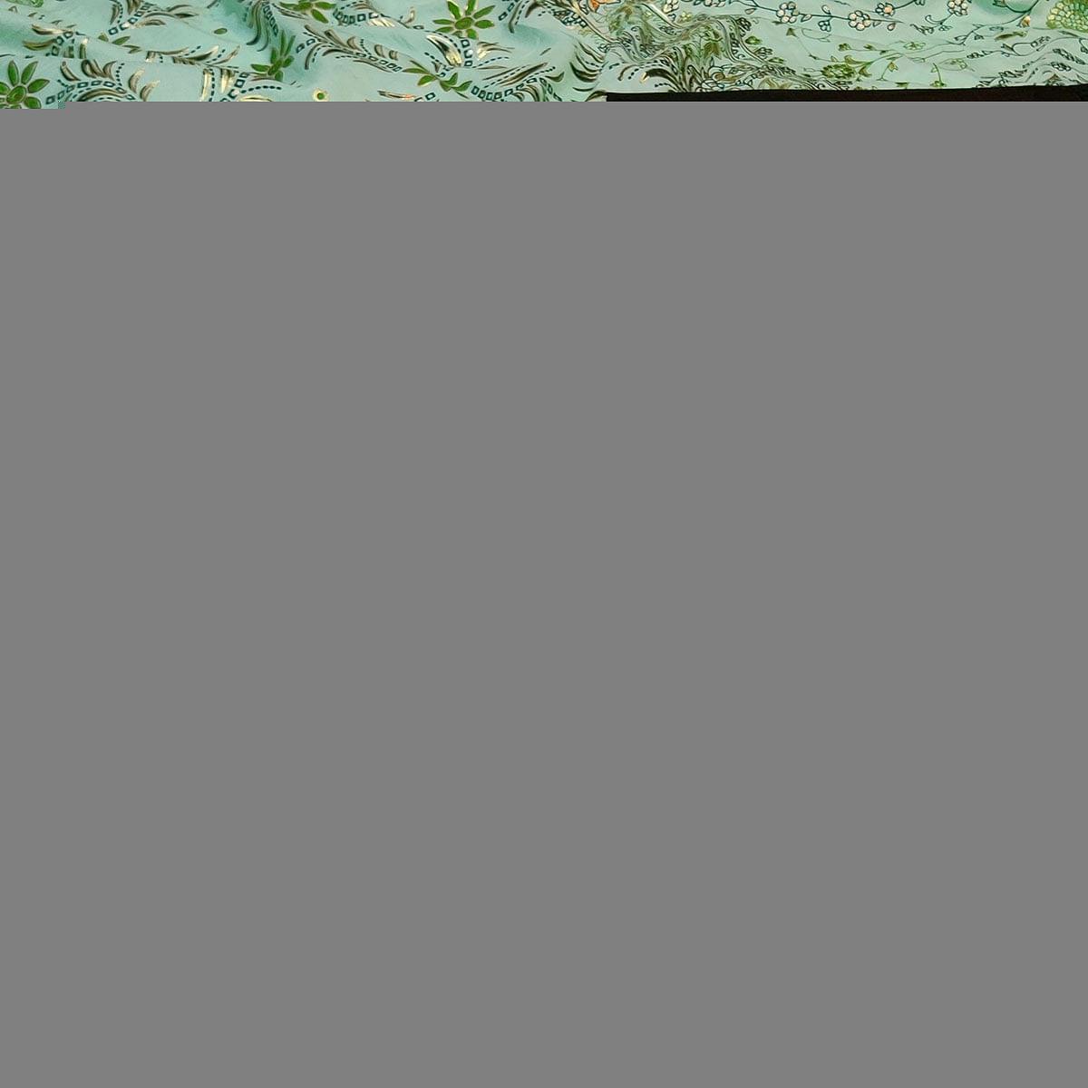 Flattering Sea Green Colored Festive Wear Printed Dola Silk Saree