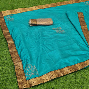 Flaunt Turquoise Coloured Casual Wear Lace Border Dola Silk Saree