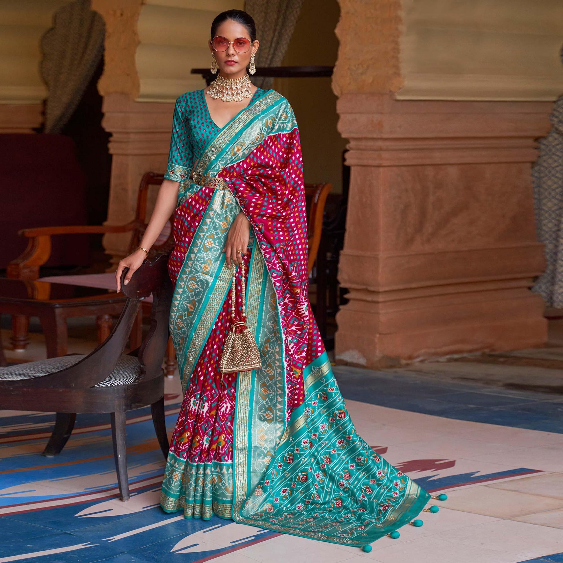 Fuchsia Pink Patola Printed Art Silk Saree With Tassels