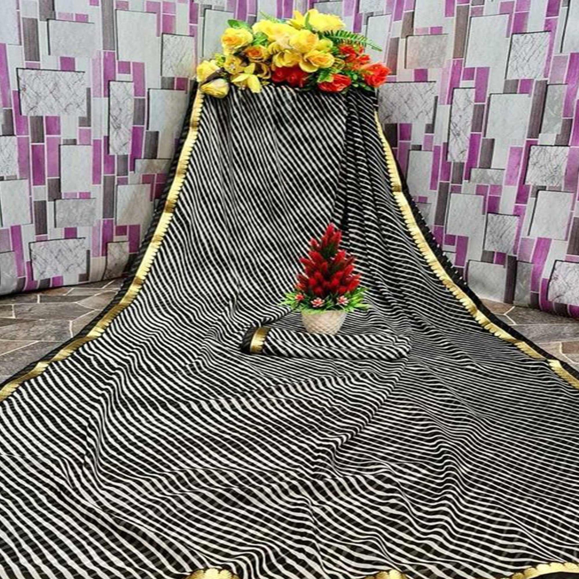 Gleaming Cream & Black Coloured Casual Wear Printed Georgette Saree