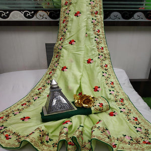 Gleaming Pista Green Colored Festive Wear Woven Dora Silk Saree