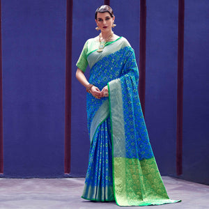 Glowing Blue Colored Festive Wear Woven Indian Patola Silk Saree