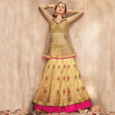 Glowing Golden-Pink Colored Party Wear Embroidered Net Lehenga Choli