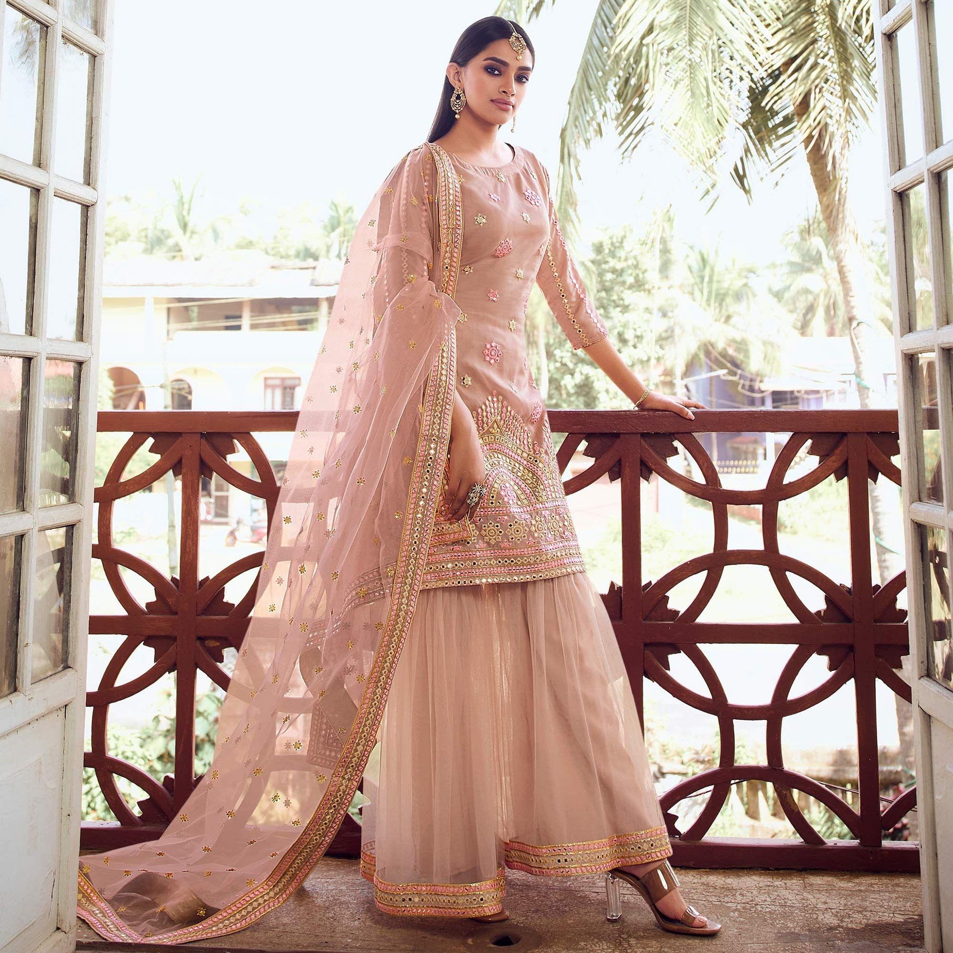Glowing Light Peach Coloured Partywear Thread Foil Mirror Work Organza Pallazo Suit