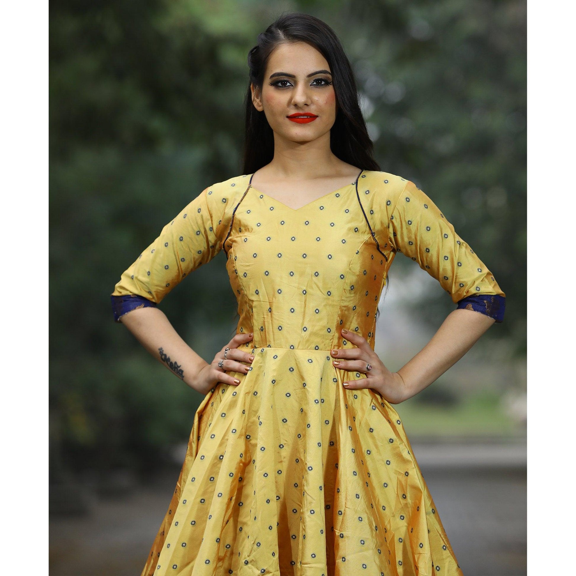 Glowing Light Yellow Colored Partywear Tapetta Gown