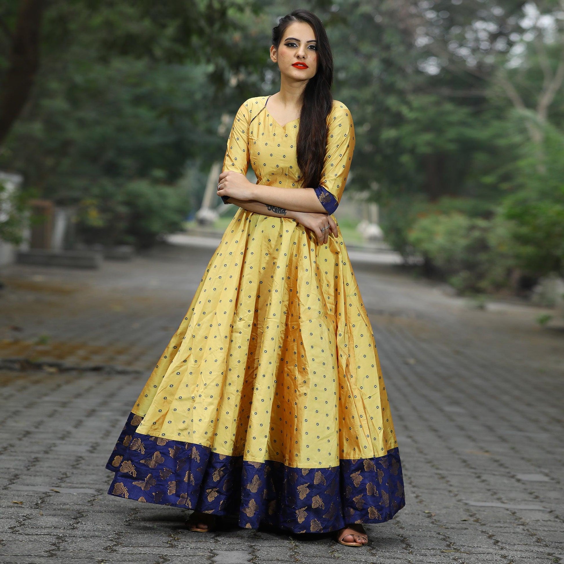 Glowing Light Yellow Colored Partywear Tapetta Gown