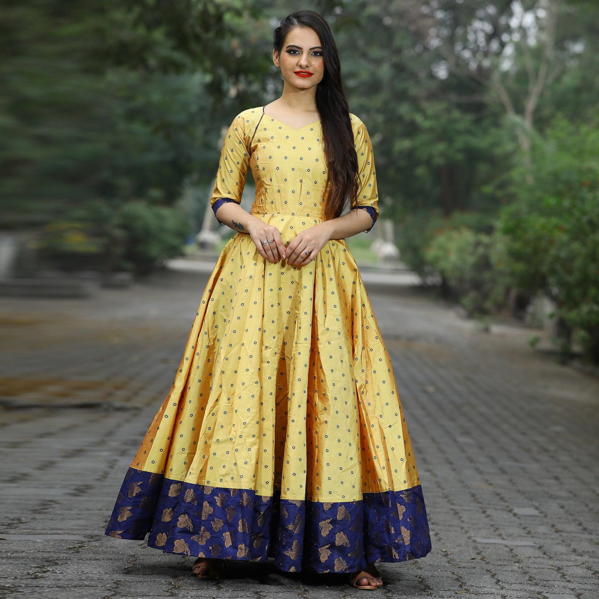 Glowing Light Yellow Colored Partywear Tapetta Gown