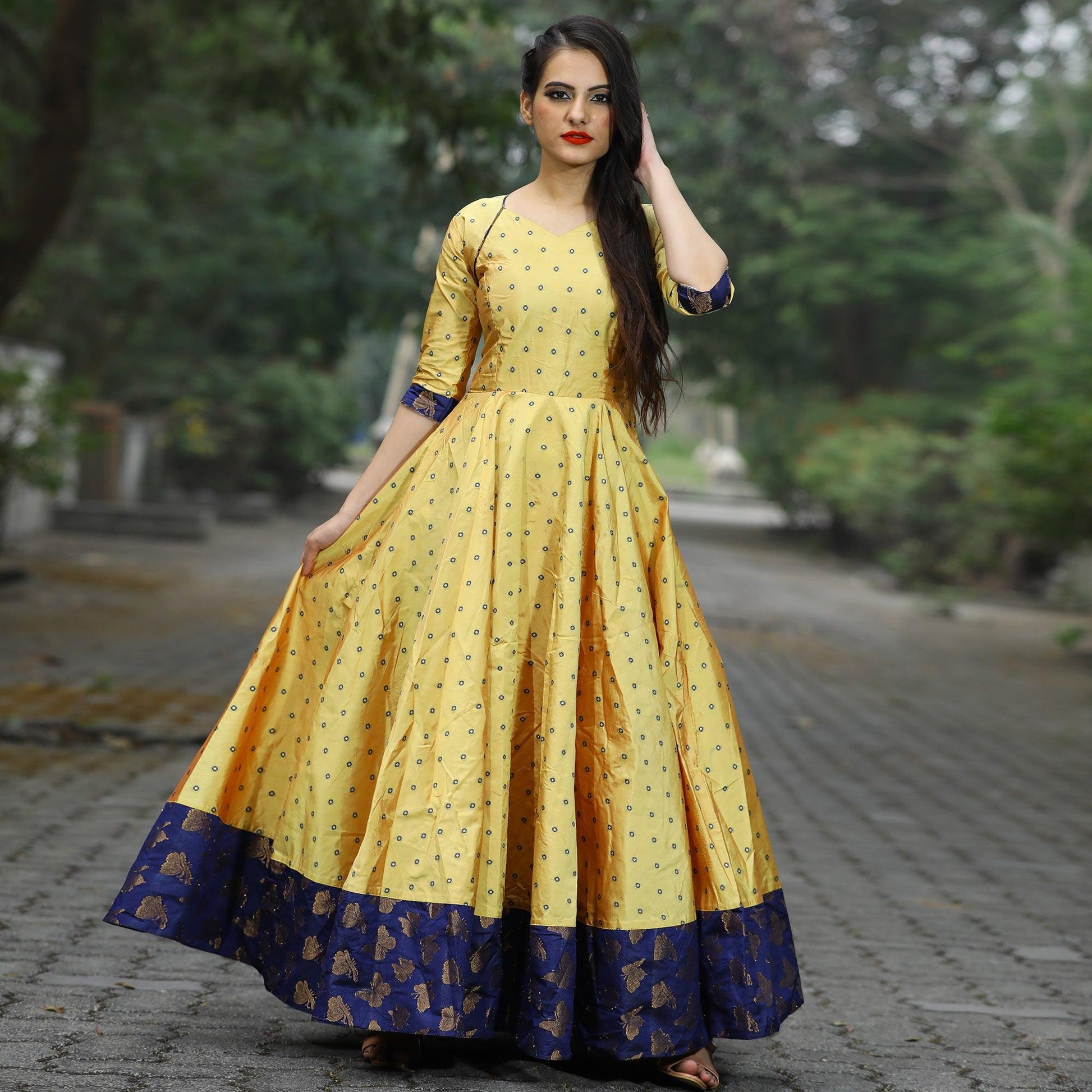 Glowing Light Yellow Colored Partywear Tapetta Gown