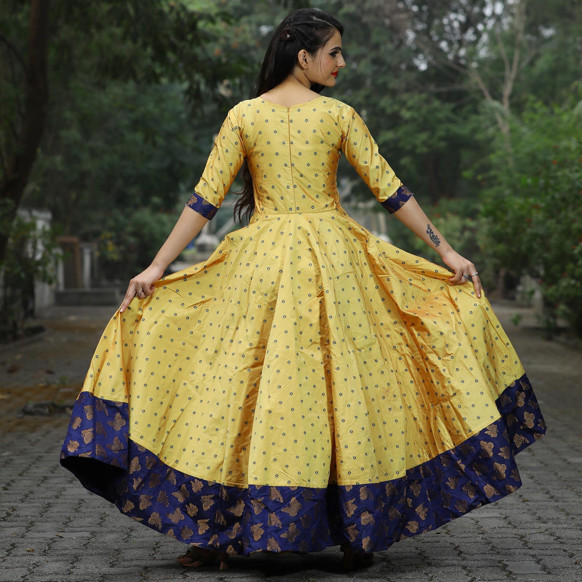 Glowing Light Yellow Colored Partywear Tapetta Gown
