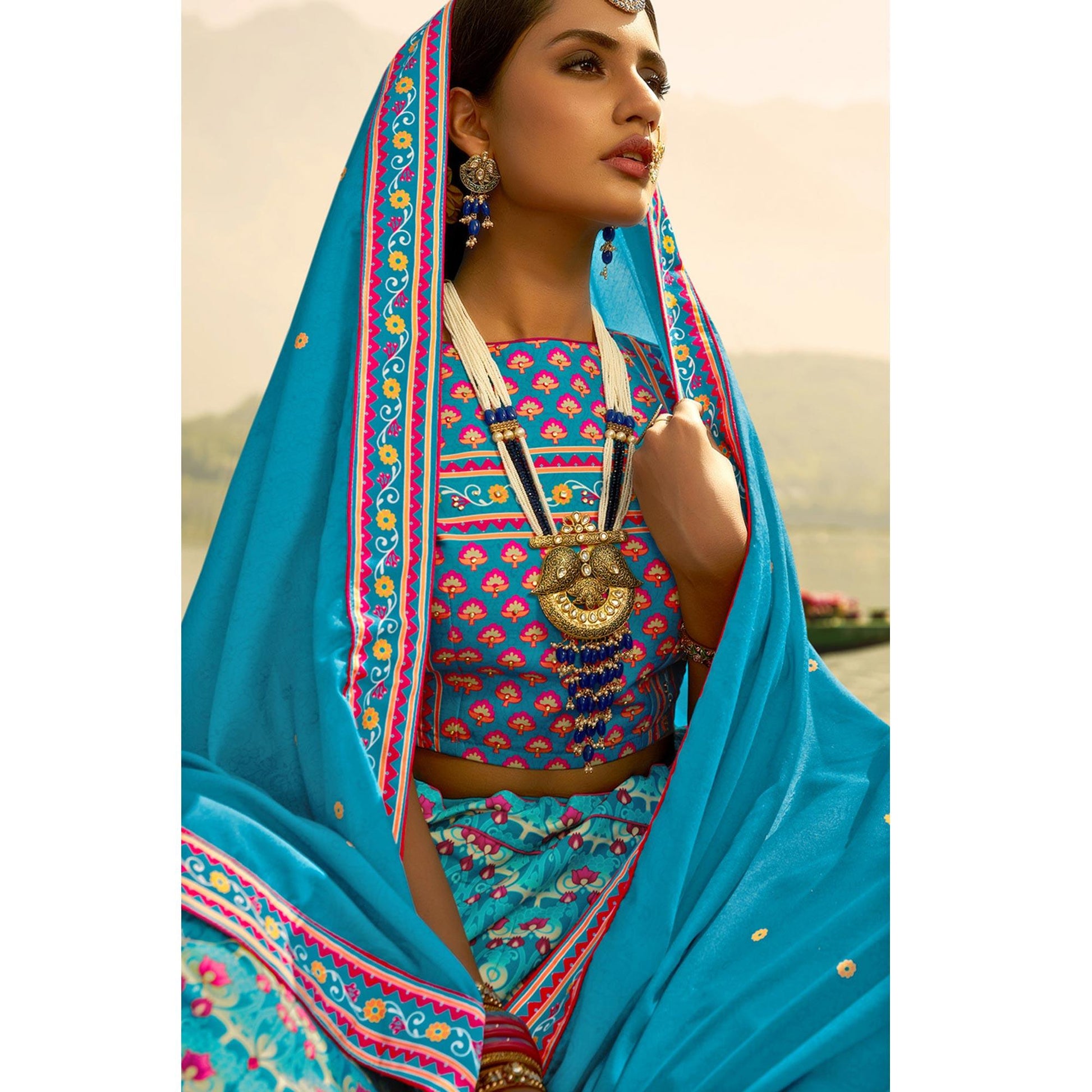 glowing-sky-blue-coloured-wedding-wear-designer-stone-work-heavy-silk-lehenga-choli-98184