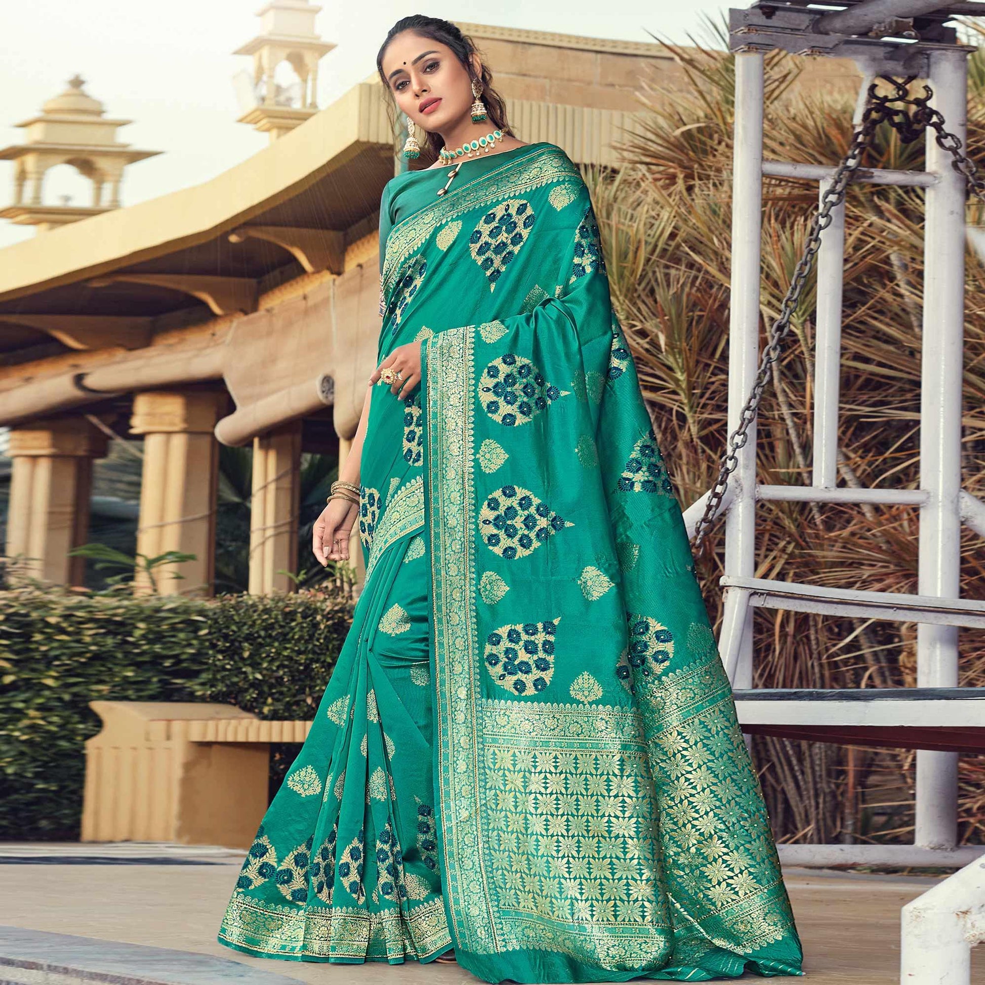 glowing-turquoise-blue-colored-festive-wear-woven-silk-saree-103555