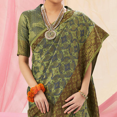 graceful-green-colored-festive-wear-woven-soft-silk-saree-69039