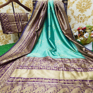 graceful-pista-green-colored-festive-wear-woven-soft-lichi-silk-saree-80272