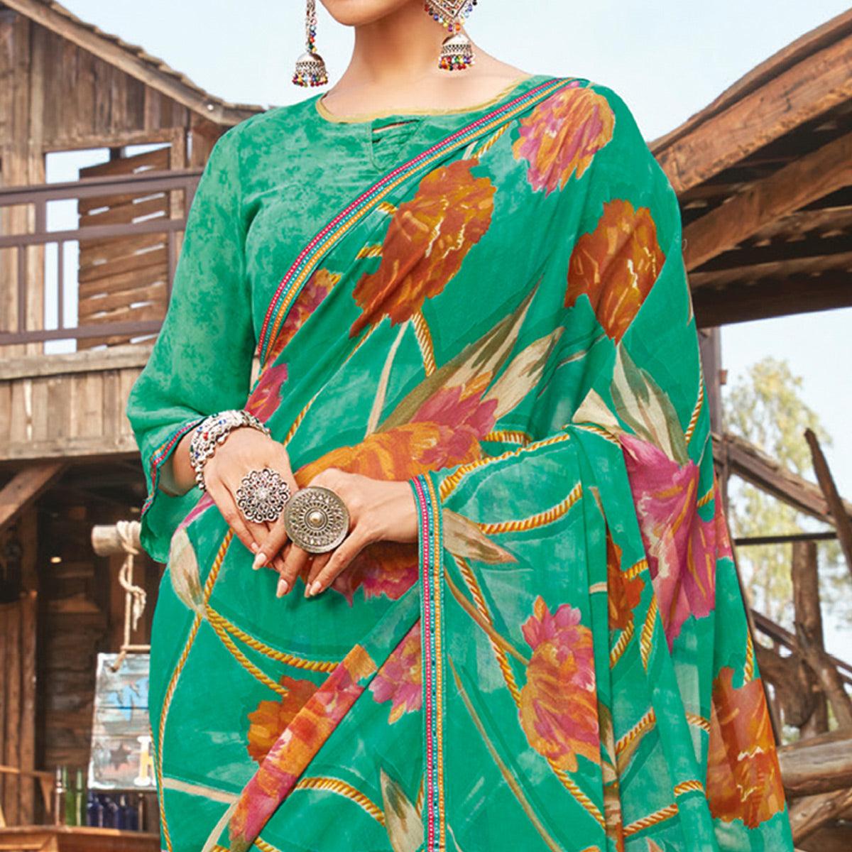 graceful-rama-green-coloured-partywear-pure-georgette-floral-printed-saree-with-fancy-lace-border-94716