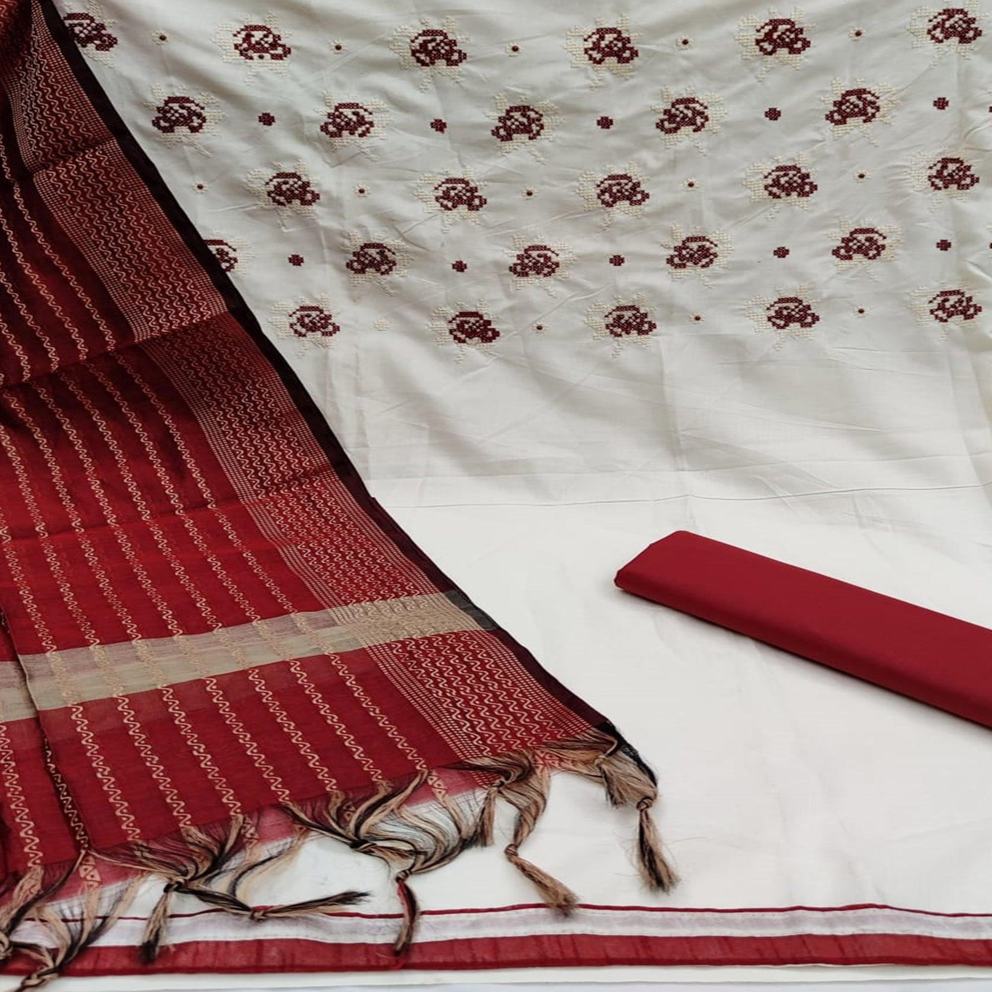 graceful-white-red-colored-partywear-embroidered-cotton-dress-material-104498