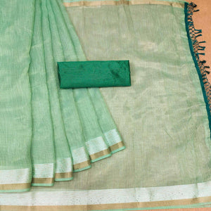 green-casual-wear-embroidered-cotton-saree-with-tassels-140631