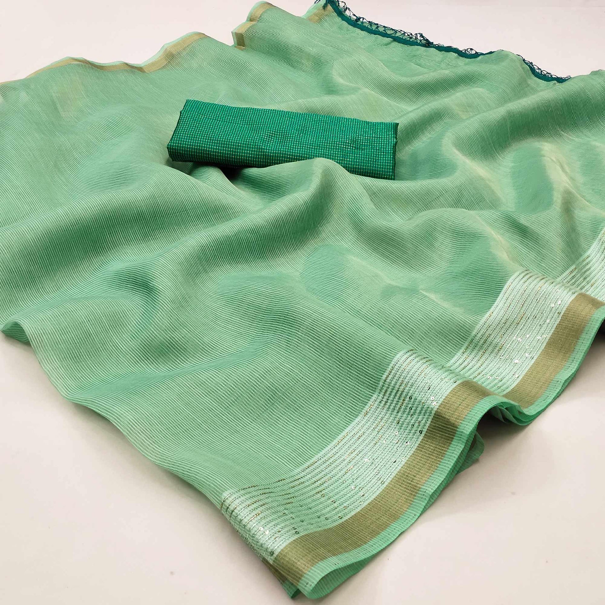 green-casual-wear-embroidered-cotton-saree-with-tassels-140631