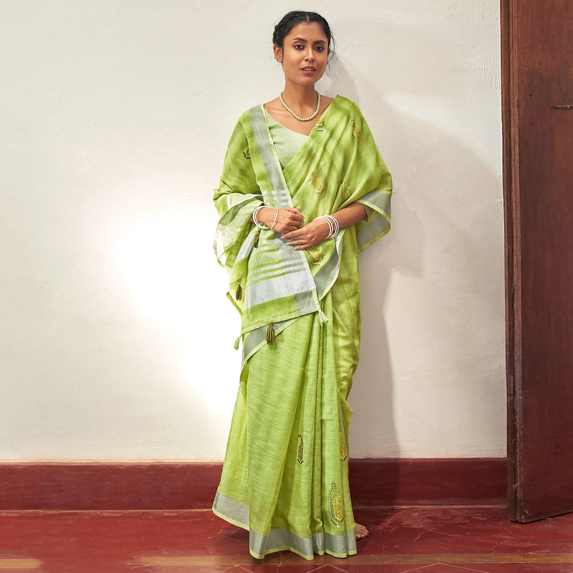 green-casual-wear-embroidered-linen-saree-with-tassels-139758