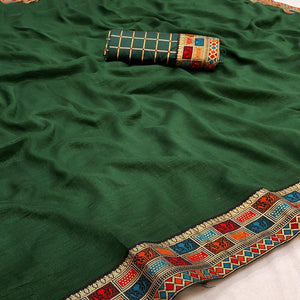 green-casual-wear-jacquard-lace-border-silk-saree-with-tassels-139263