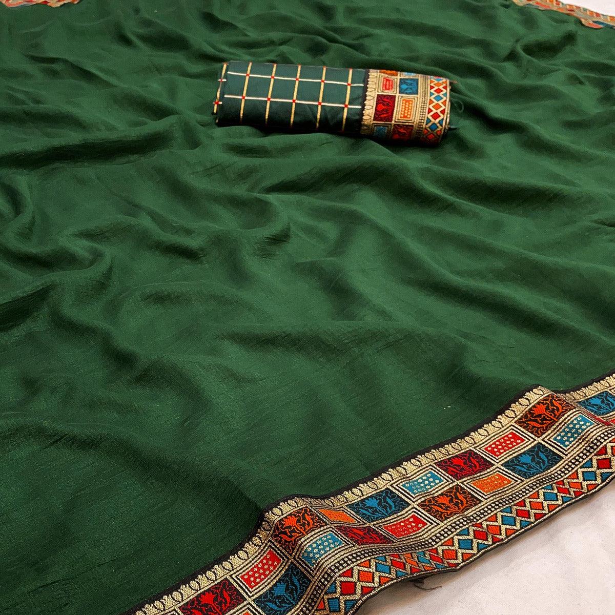 green-casual-wear-jacquard-lace-border-silk-saree-with-tassels-139263