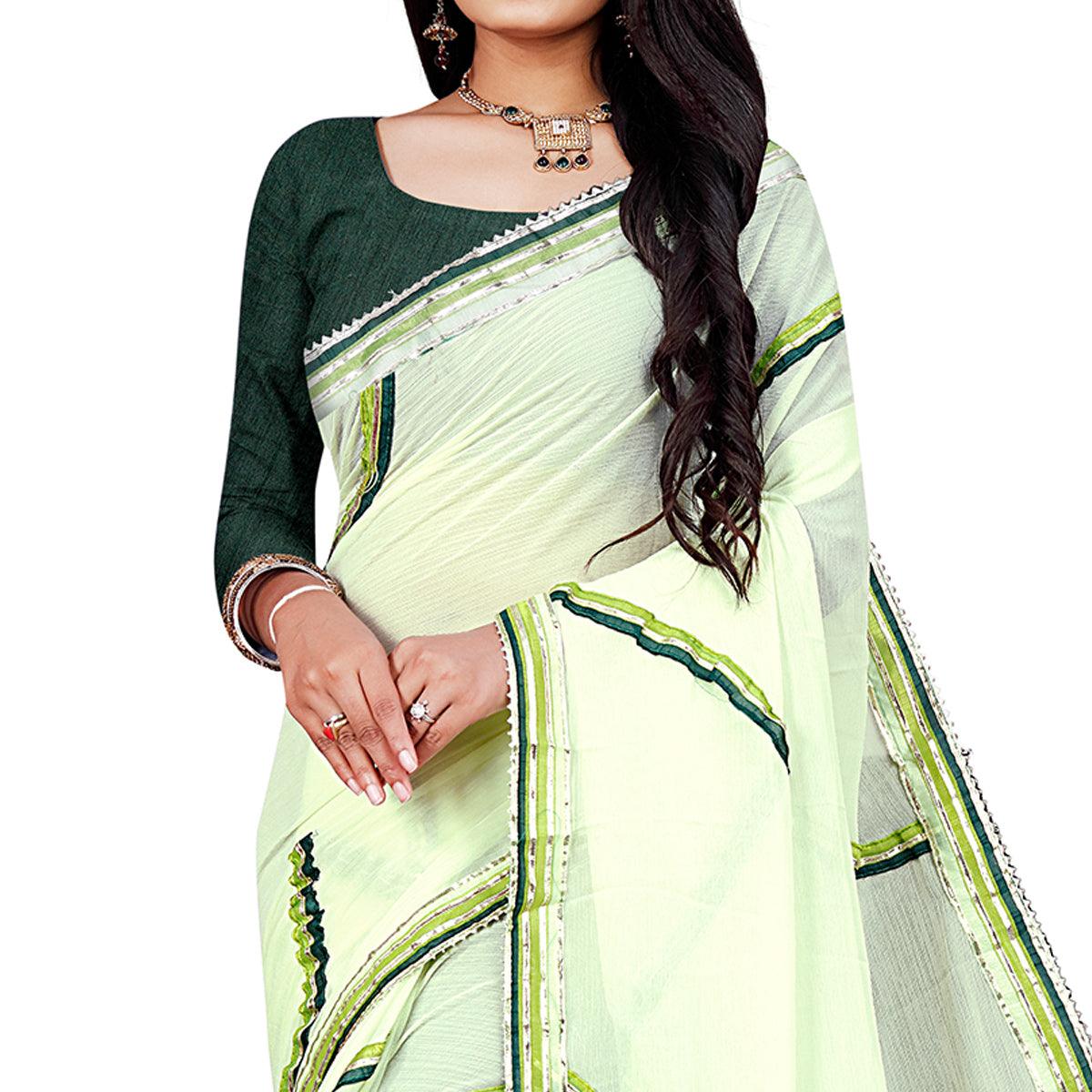 green-casual-wear-lace-work-chiffon-saree