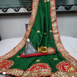 green-festive-wear-dola-silk-saree-with-gotta-patti-lace-border-123981