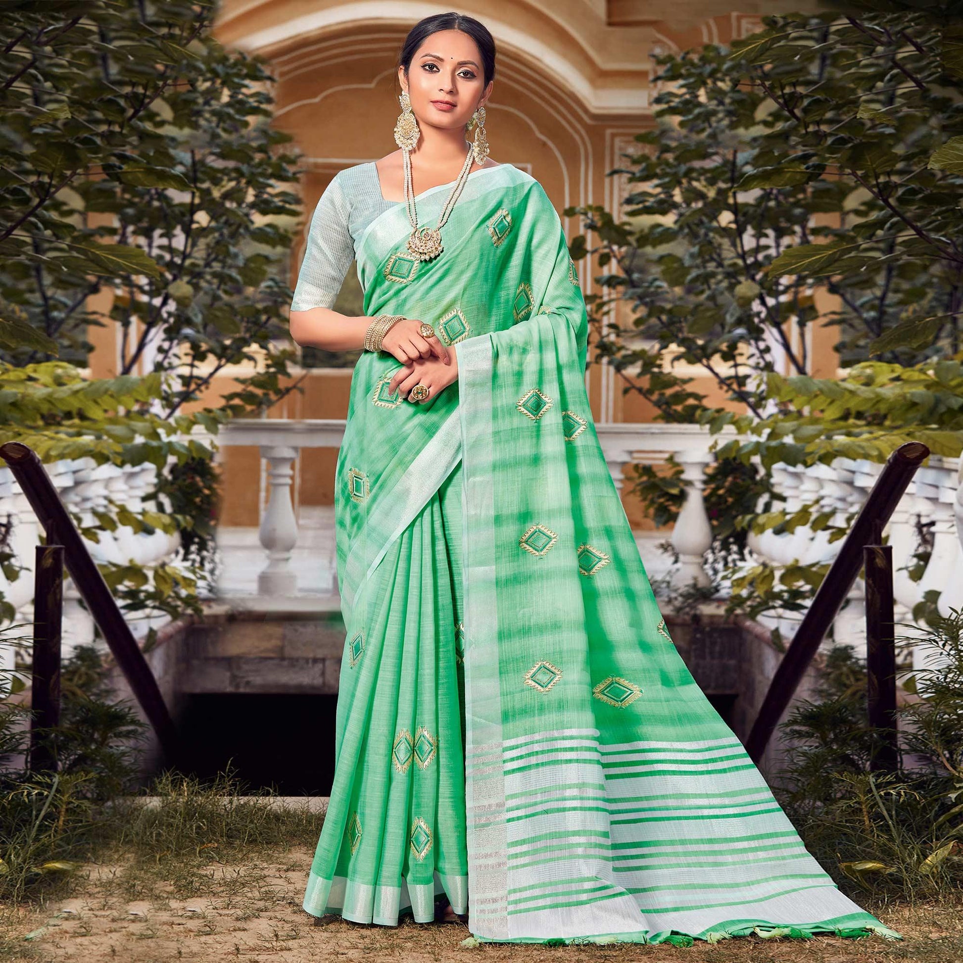 green-festive-wear-embroidered-linen-saree-118560