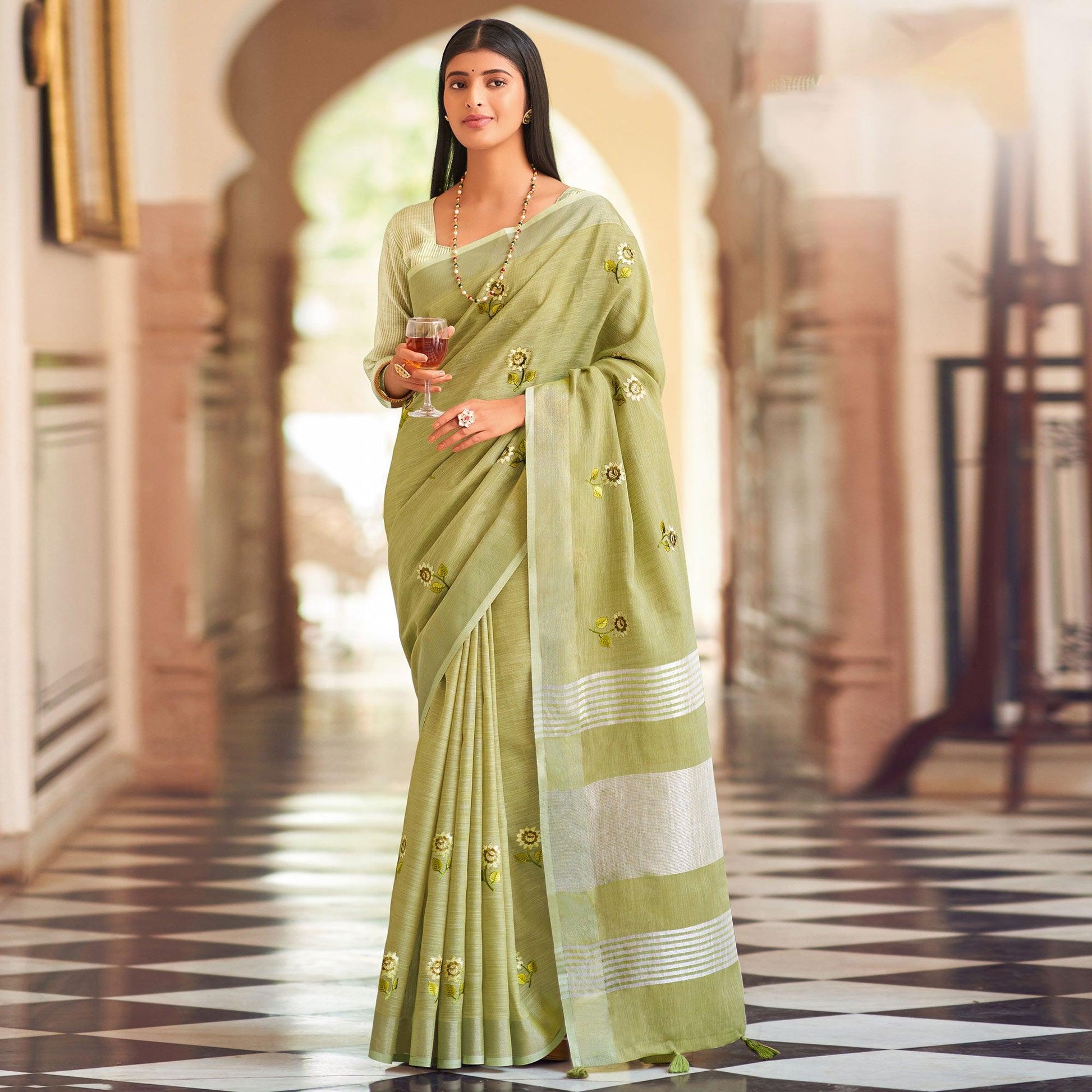 green-festive-wear-embroidered-linen-saree-135577