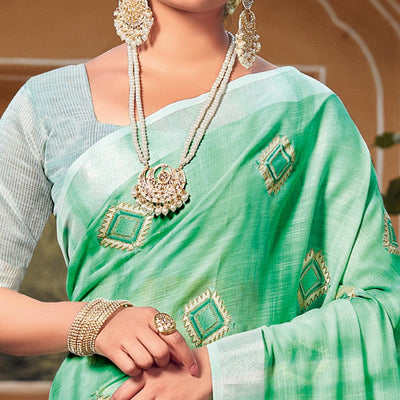 green-festive-wear-embroidered-linen-saree-118560
