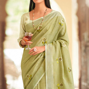 green-festive-wear-embroidered-linen-saree-135577
