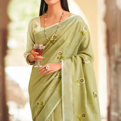 green-festive-wear-embroidered-linen-saree-135577