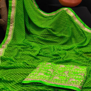 green-festive-wear-printed-with-lace-border-georgette-saree-134966