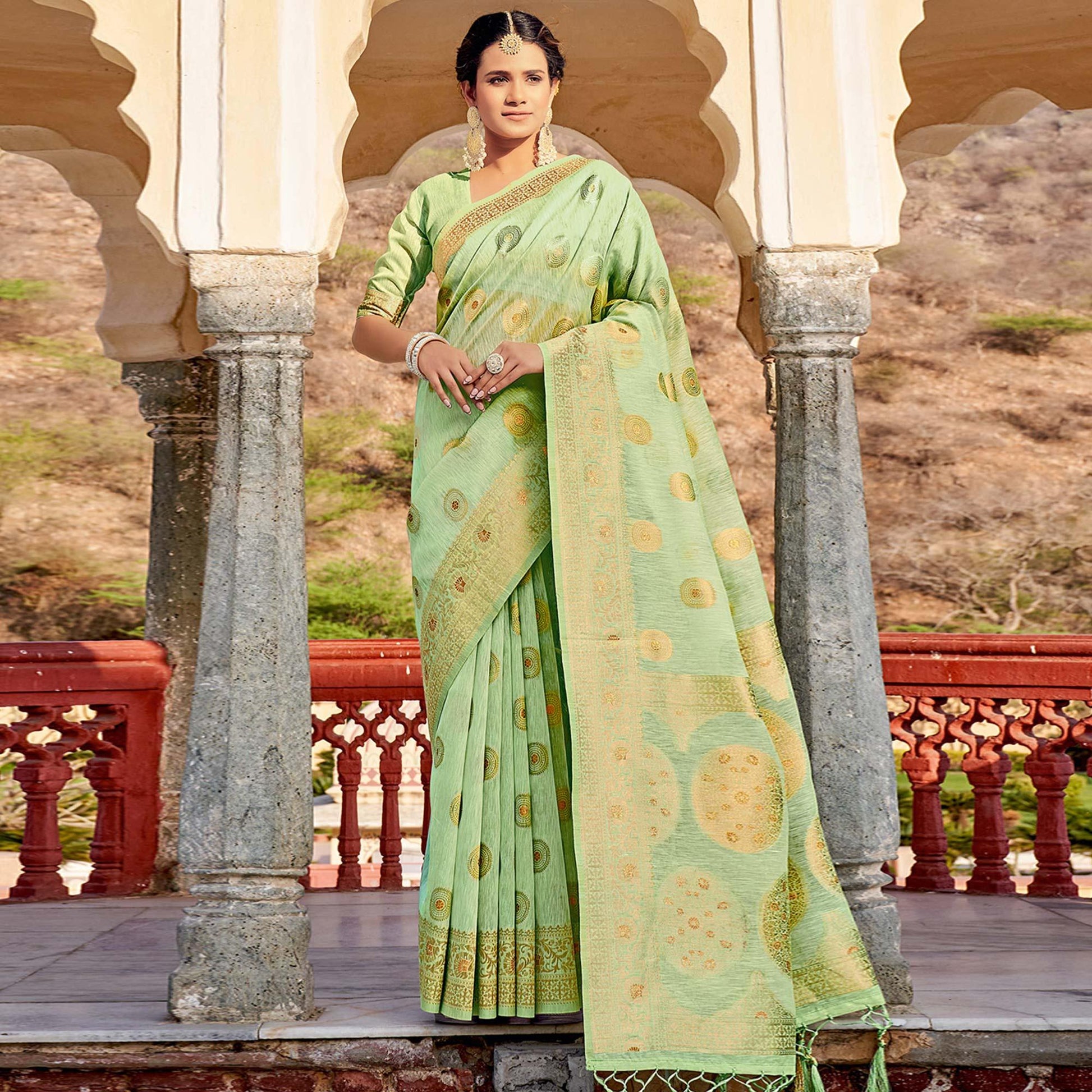 green-festive-wear-weaving-work-linen-saree-with-tassels-139515