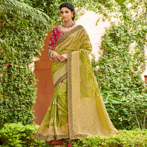 green-festive-wear-woven-embroidered-organza-saree-128556