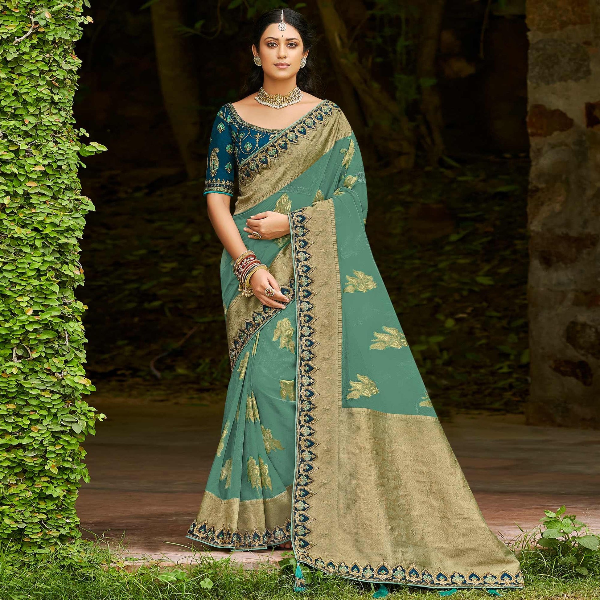 green-festive-wear-woven-embroidered-organza-saree-128554