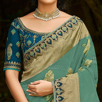 green-festive-wear-woven-embroidered-organza-saree-128554