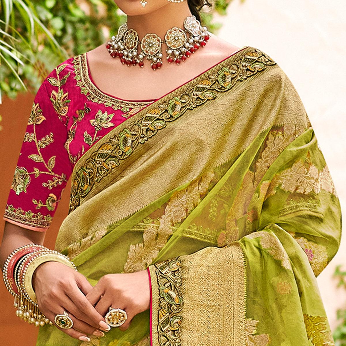 green-festive-wear-woven-embroidered-organza-saree-128556